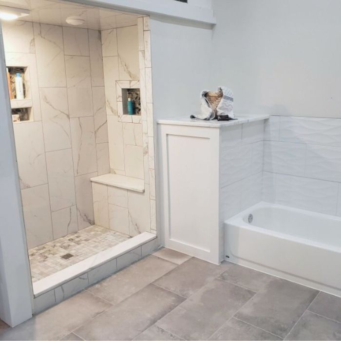 a white bathroom remodel by Aikey