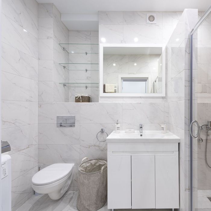 shelves above toilet in bathroom