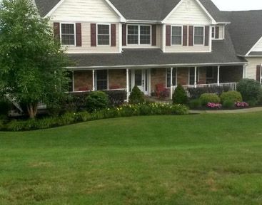 home with nice landscaping and yard