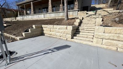home with rock steps and a retaining wall