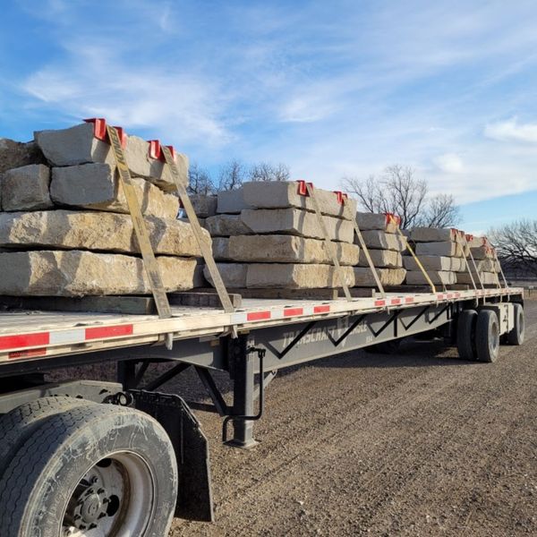limestone strapped on a truck for transport