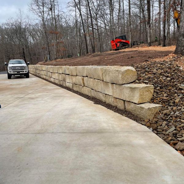 retaining wall beside a driveway