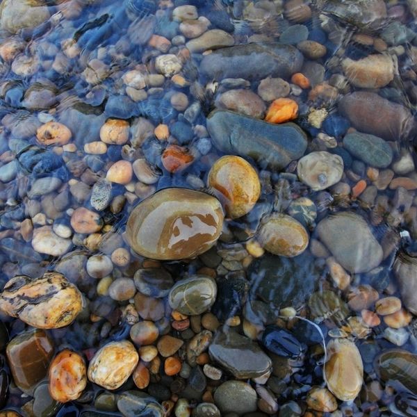 water running over river rock