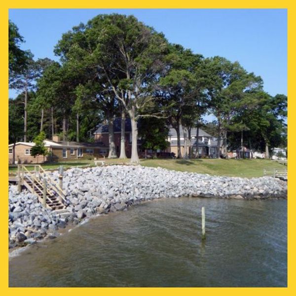 river rock wall around pond