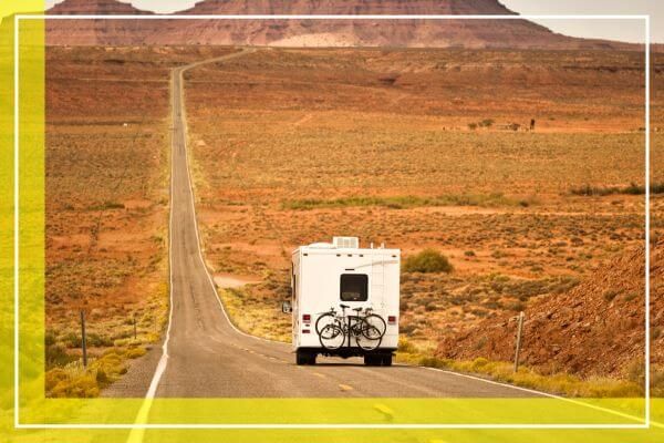RV driving down a desert road