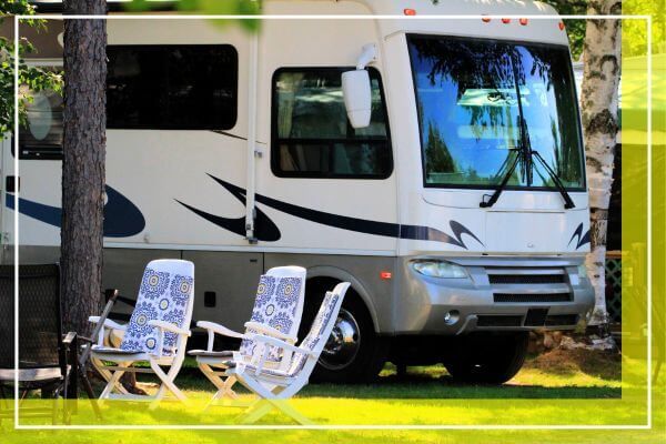RV with chairs on the lawn