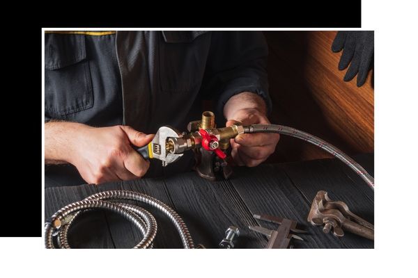 Plumber working on plumbing lines