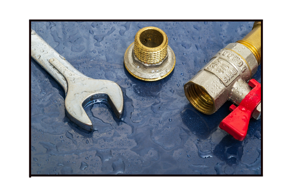 plumbing tools on wet surface