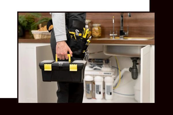 Plumber standing in front of a sink