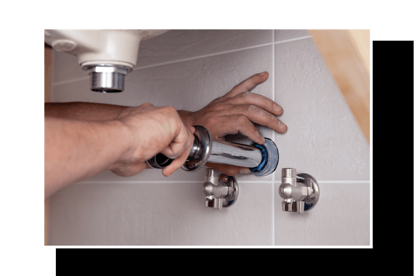 plumber working on pipes