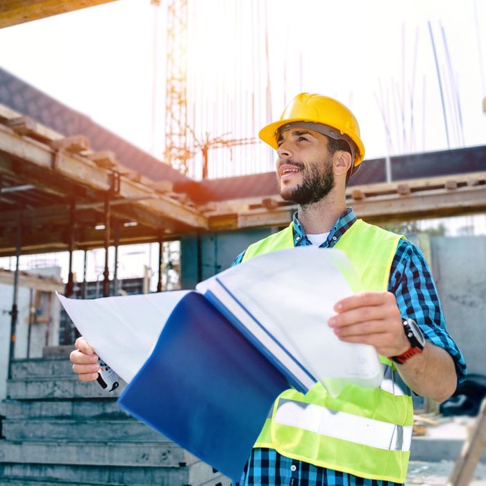 construction worker looking at paperwork