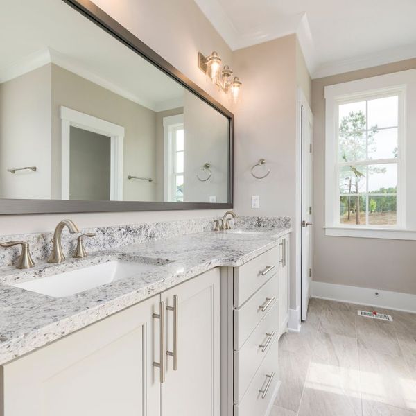 Bathroom with grayish-white quartz countertops