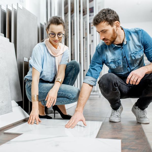 people looking at flooring samples together