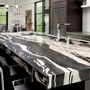 a black and white granite island in a kitchen