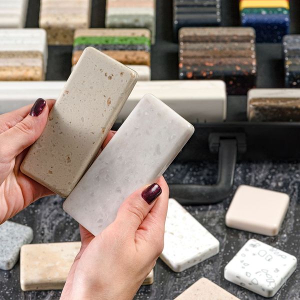 Woman holds countertop samples