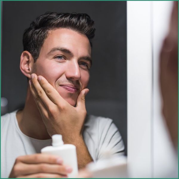 Man washing his face