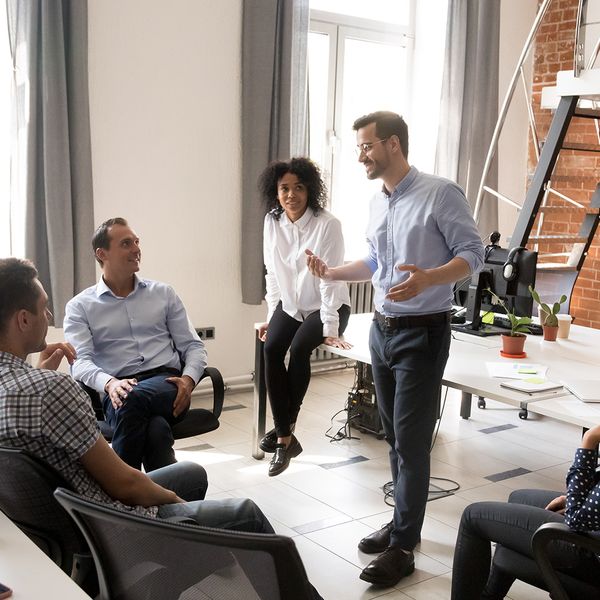  image of a group of people having a discussion in an office