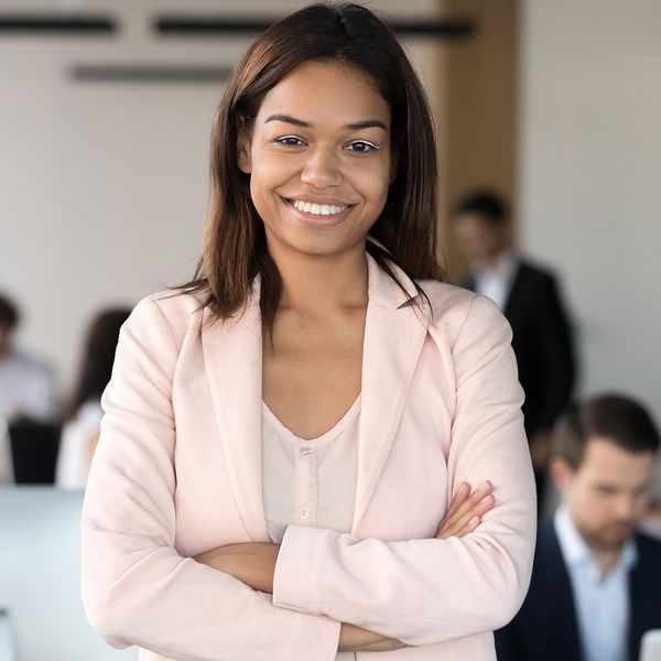  image of a business woman smiling with arms crossed