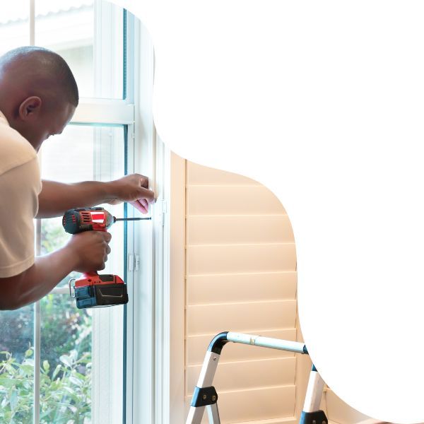 Man installing polywood shutters 