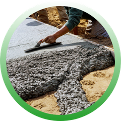 Circular icon featuring a close-up of a worker using a hand trowel to smooth out wet concrete on a new pathway.