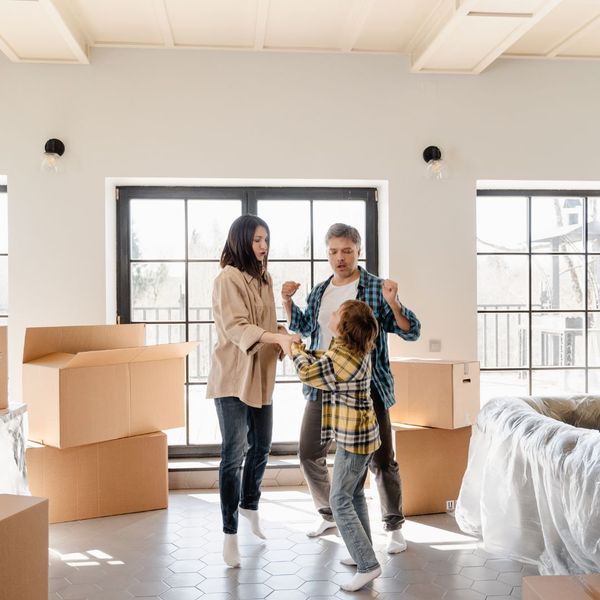 Family dancing inside a home