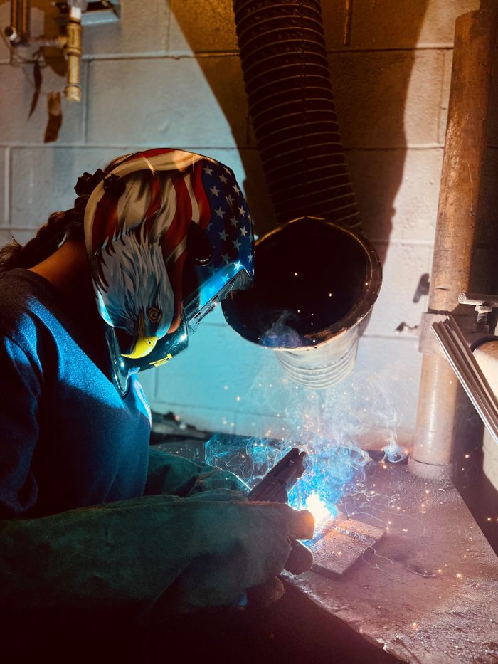Girl welding from Jr High Summer Camp.jpg