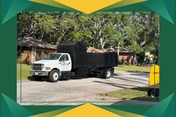 5 Star Service truck hauling away debris 5 Star Service truck hauling away debris
