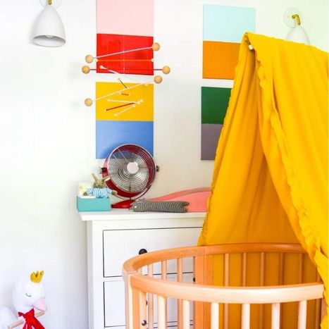 Image of a nursery with two wall sconces