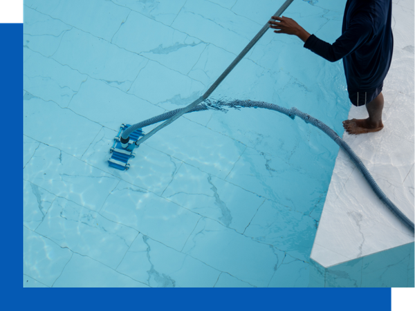 cleaning the bottom of a swimming pool