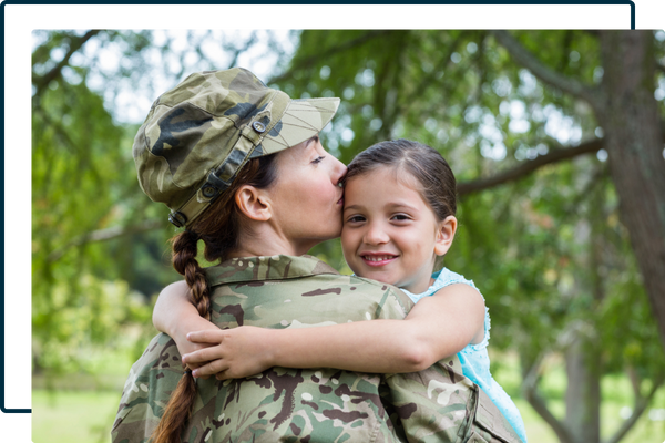 military mom hugging her daughter