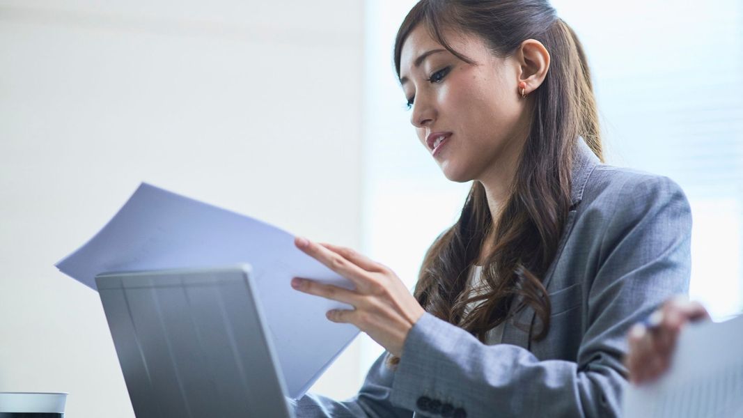 woman looking at paperwork