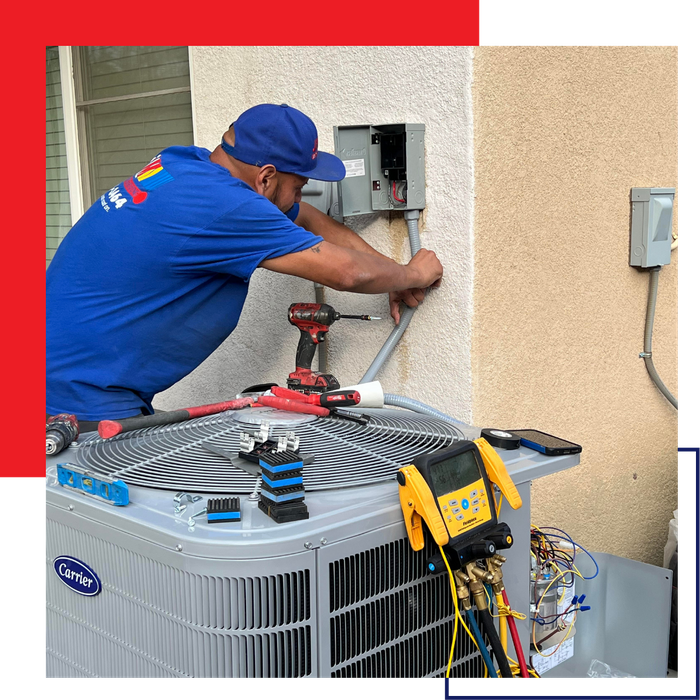 J&M team member servicing an air conditioner J&M team member servicing an air conditioner