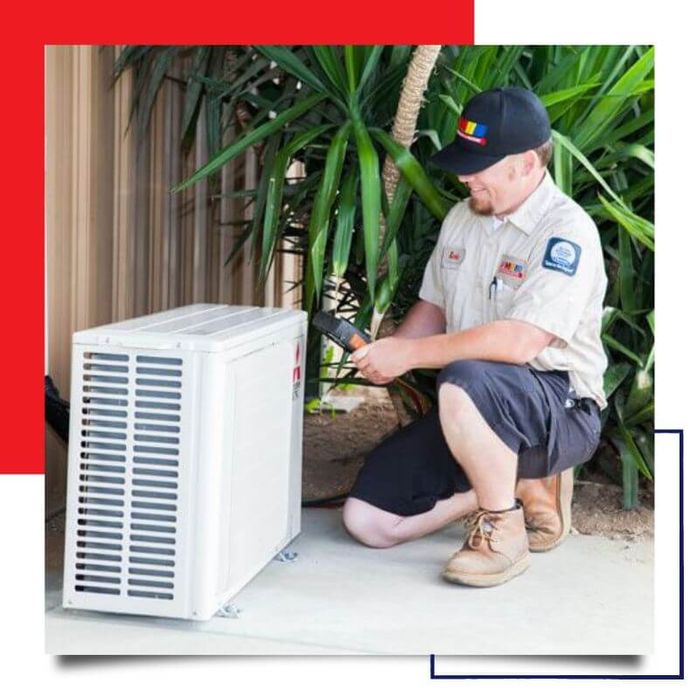 professional working on air conditioner