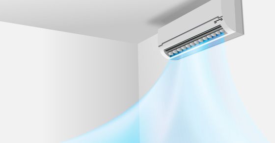 AC unit on a wall with illustration of cool air flowing from it