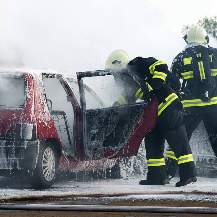 Firemen at car fire