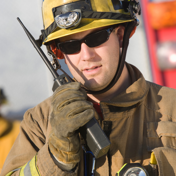 firefighter talking in a walkie talkie 