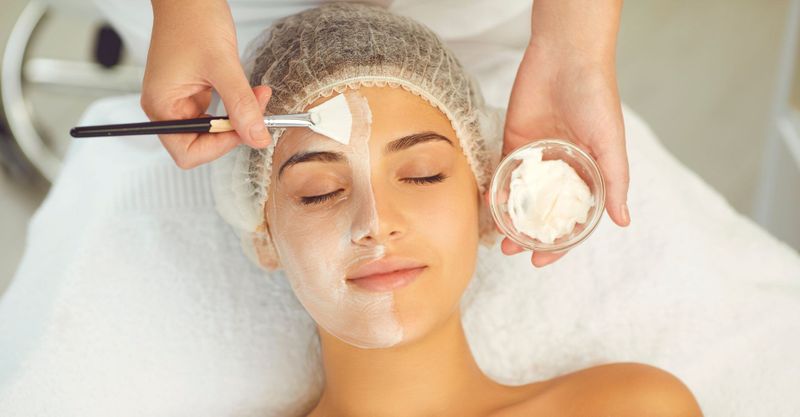 Top view of woman getting chemical peel application