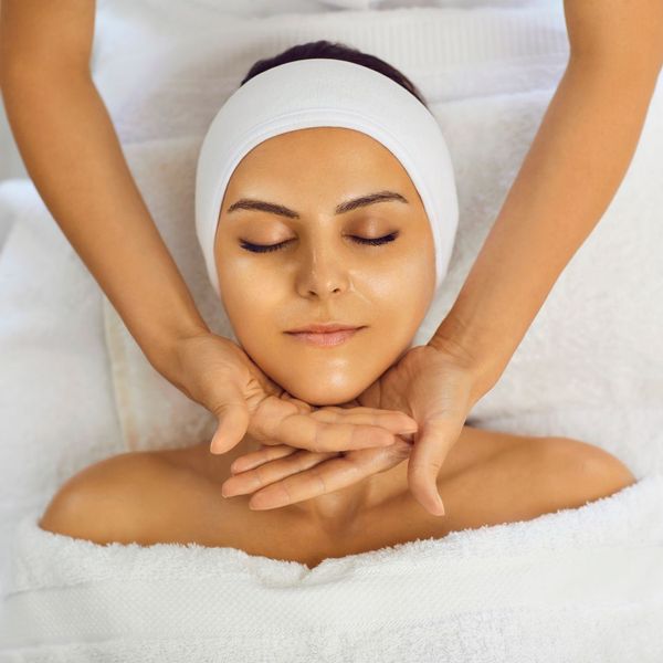 woman receiving facial treatment