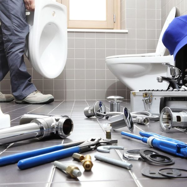 plumbing tools in bathroom, replacing toilet