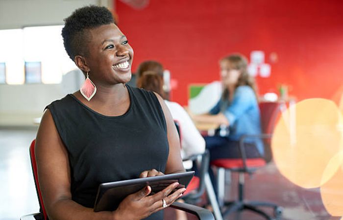 a business woman holding a tablet