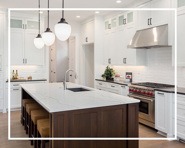 white quartz countertops in a natural wood and white kitchen