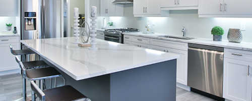 white and grey countertops in a grey and white kitchen