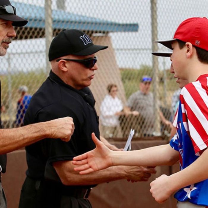 Elite Baseball players shake hands with umpires