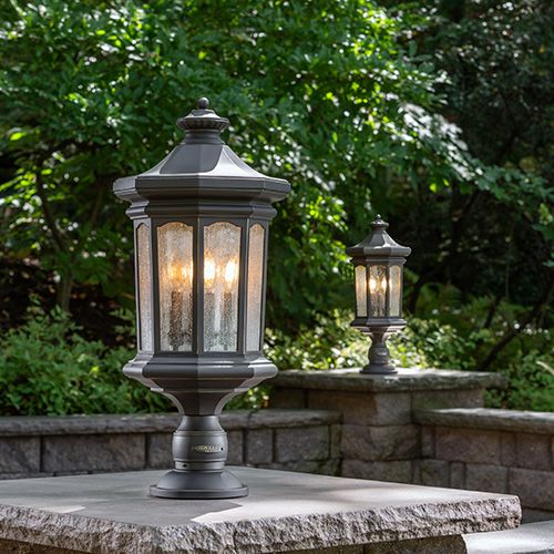 Lamps on plantars in landscaped yard