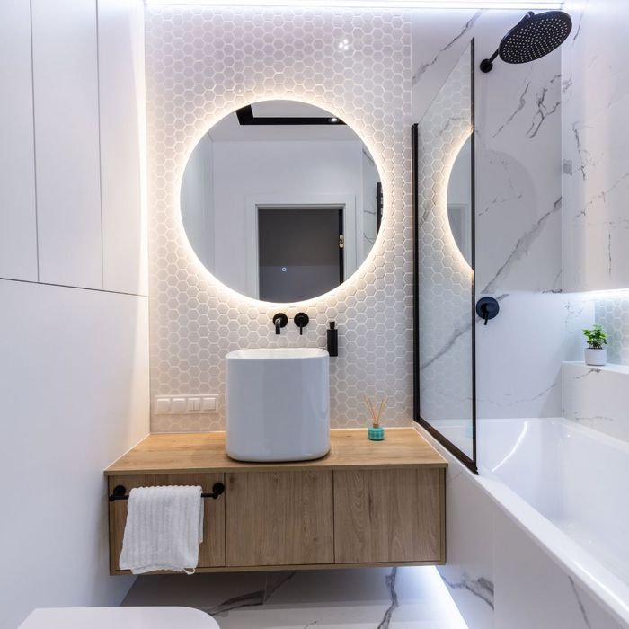 bathroom with lighted mirror