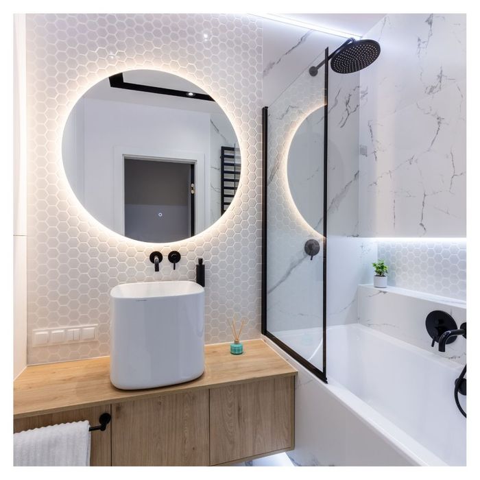 bathroom with lit up mirror