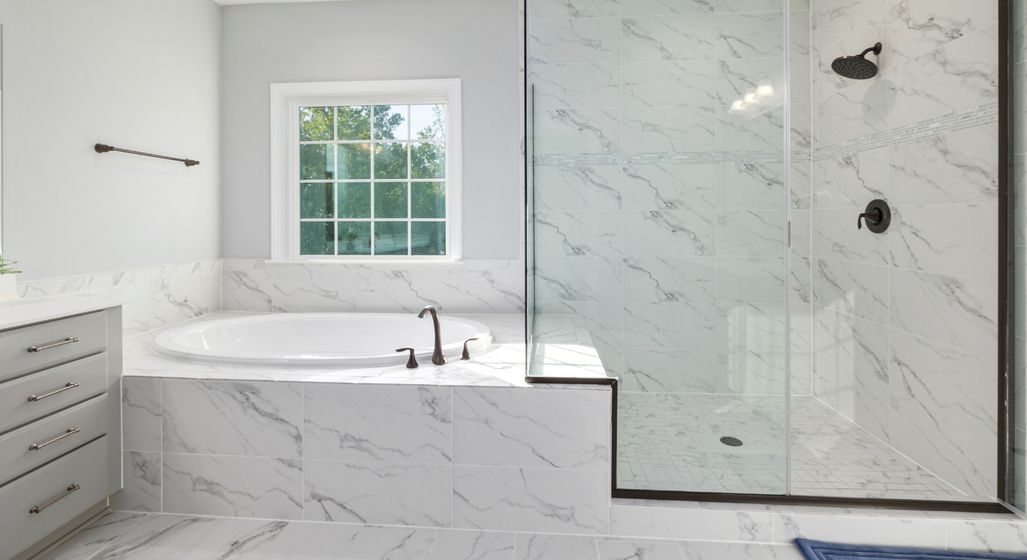 Bathroom with a bathtub and walk-in shower