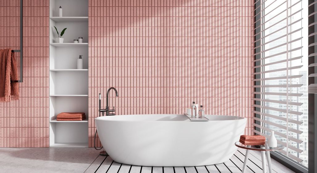 bathroom with pink tiled accent wall