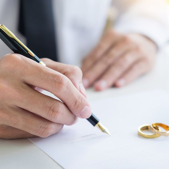 filling petition form agreement of divorce in office at lawyer desk in the court room 