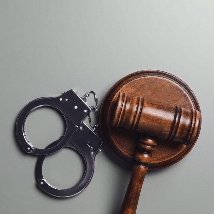 Judge gavel next to handcuffs